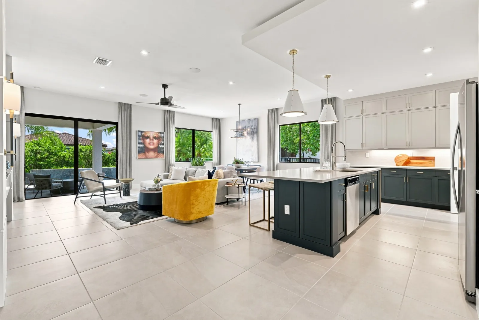 Bright great room joining the kitchen, living area and sliding glass doors