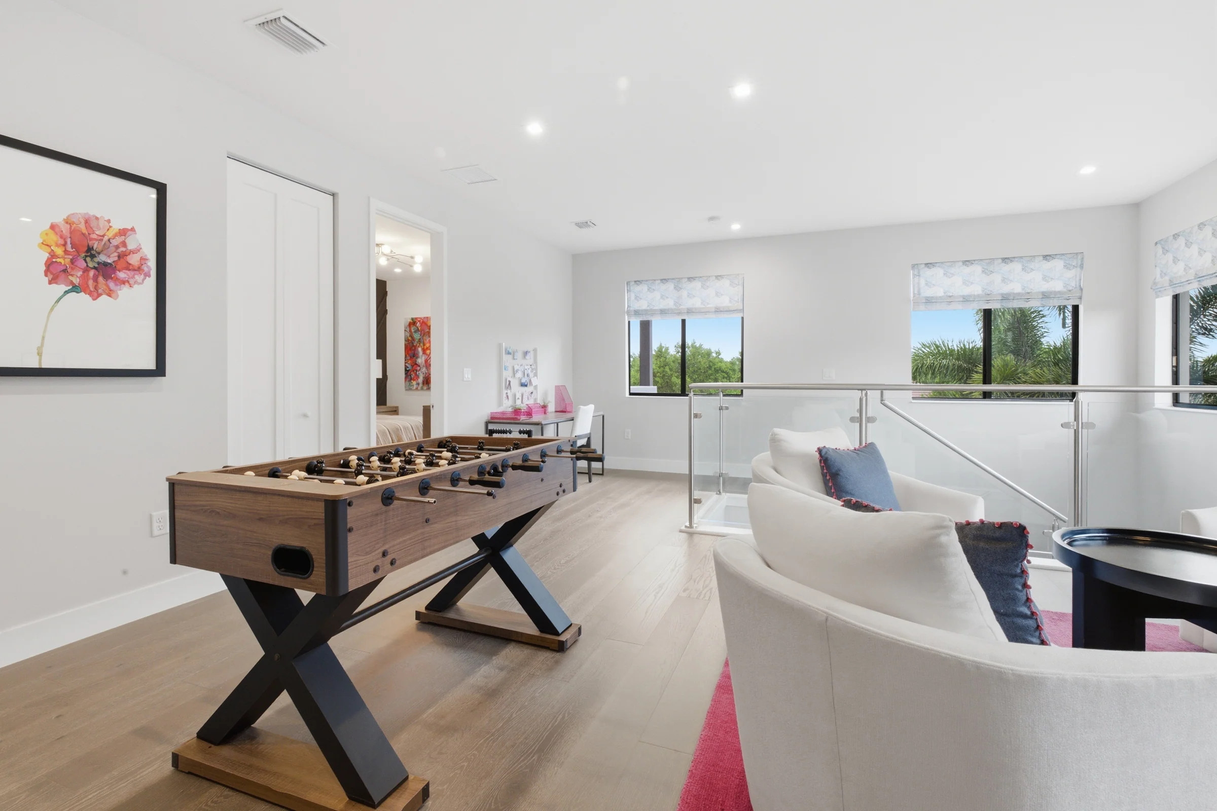 Loft with a foosball table and lounge chairs
