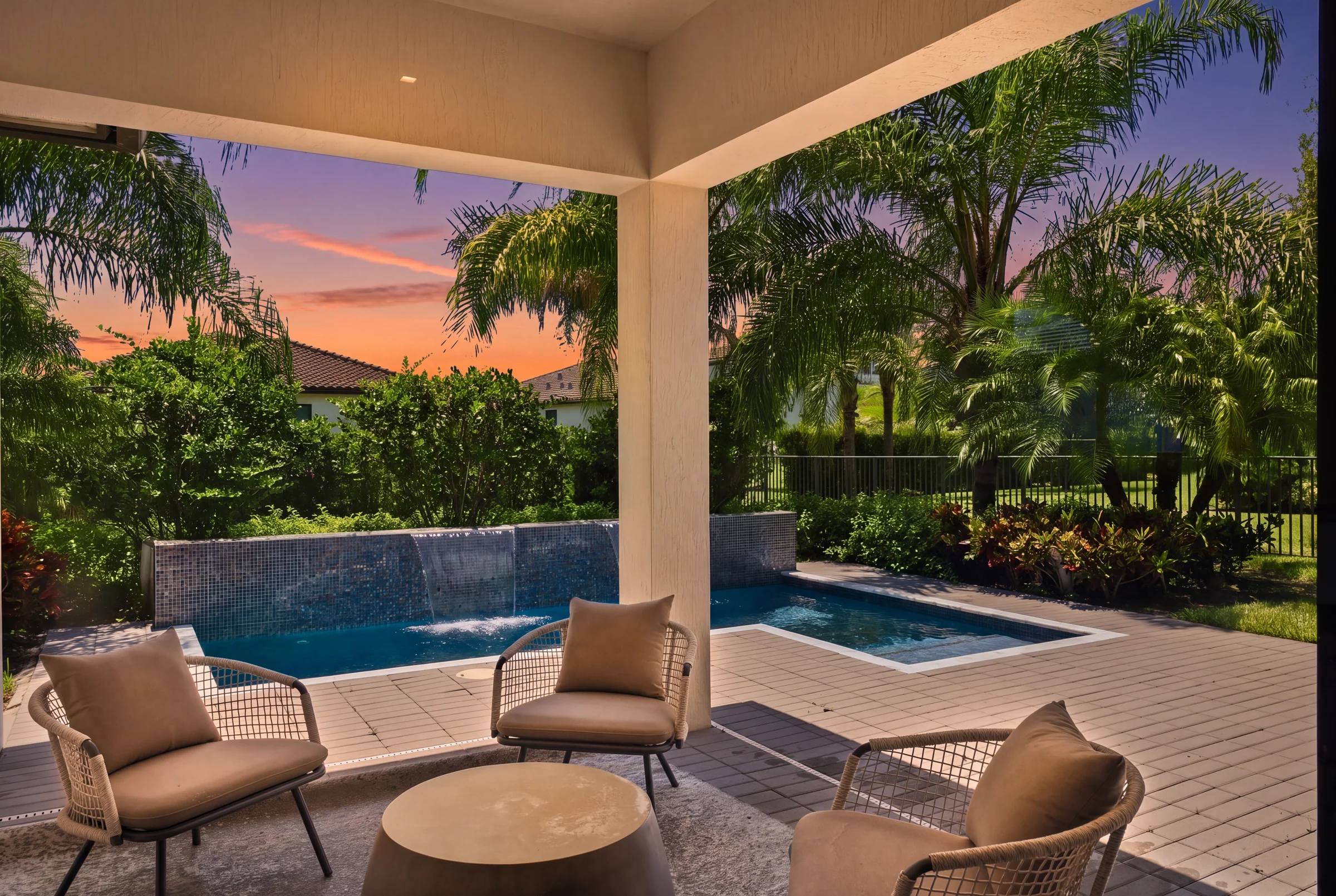 Covered patio and plunge pool beneath a twilight sky (virtual twilight, digitally enhanced)